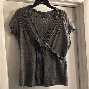 Gray top with floral beaded accents. Crossover v neck. Size L